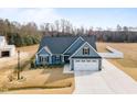 Charming home with a two-car garage, manicured lawn and craftsman design elements at 220 Pepperdam St, Smithfield, NC 27577