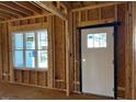 Framed entryway with a window and exterior door at 28 Golden View Pl, Zebulon, NC 27597