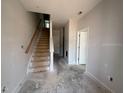 Entryway features stairs to the upper level, light gray paint, and white doors at 307 Chesapeake Commons St # 100, Garner, NC 27529