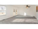 Spacious living room with a ceiling fan and access to an outdoor deck at 325 Bainbridge Cir, Garner, NC 27529