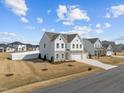 Suburban two-story home in a neighborhood with a curved driveway at 350 Arlie Ln, Lillington, NC 27546