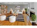 Stylish living room boasts hardwood floors and elegant fireplace at 4023 Cashew Dr, Raleigh, NC 27616