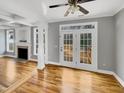 Open living area featuring hardwood floors and French doors to the deck at 4023 Cashew Dr, Raleigh, NC 27616