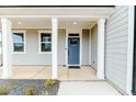 Inviting front porch with stylish columns and a welcoming blue door at 430 St. Claire Dr, Fuquay Varina, NC 27526