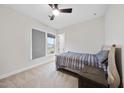 Cozy bedroom with a comfortable bed, carpeted floors, and a bright window view at 616 Long Lake Dr, Fuquay Varina, NC 27526