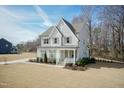 Well-maintained two-story home with a lush front lawn, perfect for outdoor activities at 76 Freewill Pl, Raleigh, NC 27603