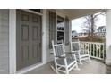 Comfortable porch with rocking chairs, perfect for relaxing and enjoying the outdoors at 76 Freewill Pl, Raleigh, NC 27603