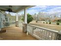 Covered front porch featuring sturdy white railings with brick column bases and exterior view at 100 E Delafield Ave, Durham, NC 27704