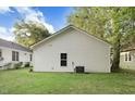 The backyard offers a peaceful green space with mature trees and is ideal for outdoor enjoyment at 1286 W Blackman Rd, Dunn, NC 28334