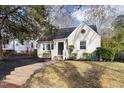 Charming home featuring classic brickwork, complemented by well-manicured landscaping at 1304 N Duke St, Durham, NC 27701