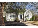 Charming home featuring classic brickwork, complemented by well-manicured landscaping at 1304 N Duke St, Durham, NC 27701