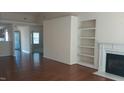 Spacious living room with hardwood floors, fireplace, and ample natural light at 1906 Hawfields Crossing Ln, Mebane, NC 27302