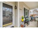 Cozy front porch featuring seating, plants, and a clear view of the home's entrance at 1928 Jupiter Hills Ct, Raleigh, NC 27604