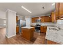 Updated kitchen featuring granite countertops, stainless steel appliances, and wood cabinets at 264 Farrington Dr, Clayton, NC 27520