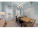 Bright dining room with stylish lighting and a beautiful ceiling design at 277 Martins Mill Ct, Wendell, NC 27591
