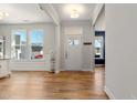 Bright entryway with hardwood floors and stylish front door at 33 Song Breeze Cir, Angier, NC 27501