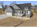 Aerial view of a lovely two-story home with manicured lawn at 33 Song Breeze Cir, Angier, NC 27501