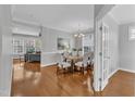 Elegant dining room featuring hardwood floors and an adjacent living room at 413 Westfalen Dr, Cary, NC 27519