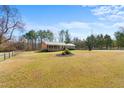 Spacious ranch-style home on a large lot, featuring mature trees and a beautifully landscaped front yard at 492 Pixley Pritchard Rd, Timberlake, NC 27583