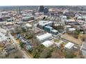 Expansive aerial view of a city showcasing diverse buildings, streets, and lush greenery at 515 N Mangum St # 14, Durham, NC 27701