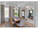 Dining room with a wood table, stylish chairs, and views of the front yard at 72 Cultivator Ct, Angier, NC 27501