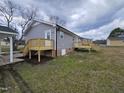 View of new deck and gray siding on the back exterior of the home at 912 Hillsboro St, Oxford, NC 27565