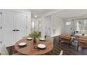 Light filled dining area boasts wood floors, and is ready for hosting with the simple, elegant place settings at 1006 Linwood Ave, Durham, NC 27701