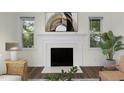 Fireplace featuring a white mantel with decorative painting and tile, offering a cozy focal point to the room at 1006 Linwood Ave, Durham, NC 27701