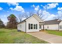 Newly constructed one-story home with a concrete driveway and recently landscaped yard at 1021 E Edgerton St, Dunn, NC 28334
