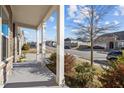 Covered front porch with white columns and views of the front yard and quiet street at 1713 Wrenn Rd, Durham, NC 27703