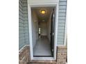 View of the home's entryway showcasing light gray vinyl flooring and white interior doors at 192 Bruce Dr, Dunn, NC 28334