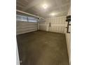 Spacious unfinished two-car garage with an automatic door, ready for customization at 192 Bruce Dr, Dunn, NC 28334