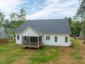 A spacious backyard featuring a screened-in porch, offering a perfect outdoor living space at 215 Purslane Dr, Franklinton, NC 27525