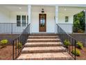 Close-up of the brick stairs leading to the front door, showcasing the home's welcoming entrance at 215 Purslane Dr, Franklinton, NC 27525