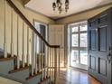Welcoming foyer with hardwood floors, stairs, and ample natural light, creating a warm ambiance at 2521 St Mary'S St, Raleigh, NC 27609