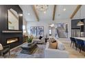 Inviting living room featuring a fireplace, vaulted ceilings, exposed beams and an open-concept design at 33 Henry Ct, Chapel Hill, NC 27516
