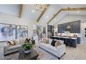 Open-concept living area with vaulted ceilings, exposed beams, and contemporary furnishings at 33 Henry Ct, Chapel Hill, NC 27516
