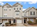 Charming townhouse boasts a beautiful stone facade and well-maintained landscaping at 650 Ganyard Farm Way # 4, Durham, NC 27703