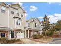 The townhouse showcases well-maintained landscaping and easy access parking at 650 Ganyard Farm Way # 4, Durham, NC 27703