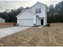 New two story home with a white exterior, concrete driveway, and attached two car garage at 6814 Galloway Dr, Middlesex, NC 27557