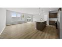 Bright and airy living room adjacent to a modern kitchen and sliding doors to the patio at 92 Ripple Way # 315, Clayton, NC 27520