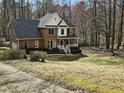 Lovely brick residence featuring classic architectural details and a lush green lawn at 1025 Shellrock Dr Dr, Wake Forest, NC 27587