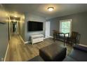 Comfortable living room with hardwood floors, modern lighting, and plenty of natural light at 105 Johnson St, Chapel Hill, NC 27516