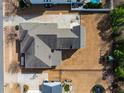 Aerial view of backyard with grass and a fence that borders other homes in the neighborhood at 120 Restonwood Dr, Apex, NC 27539