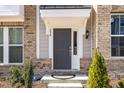 Welcoming front door showcasing updated fixtures, with elegant sidelights at 234 Palmetto Tree Way, Knightdale, NC 27545