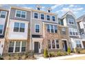 Inviting townhouse featuring a mix of brick and siding, complemented by a blossoming tree at 234 Palmetto Tree Way, Knightdale, NC 27545