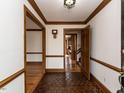 Inviting foyer featuring hexagon tile floor, wood trim, and open doorways at 241 Beachers Brook Ln, Cary, NC 27511