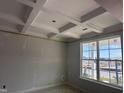 Room with trim and a bright window, offering natural light and views of the neighborhood's new construction at 316 White Oak Garden Way # 217, Garner, NC 27529