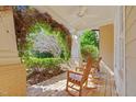 Cozy covered porch with rocking chairs, perfect for enjoying the outdoors at 3324 Thomas Rd, Raleigh, NC 27607