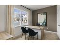 Office with desk, chairs, a large window and an earthy accent wall at 607 Dorset Stream Dr, Fuquay Varina, NC 27526